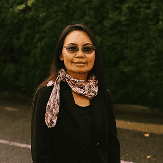 Portrait of Loon Phangnamkham, a professional stylist at Beautique Beauty Lounge, showcasing their expertise and style.