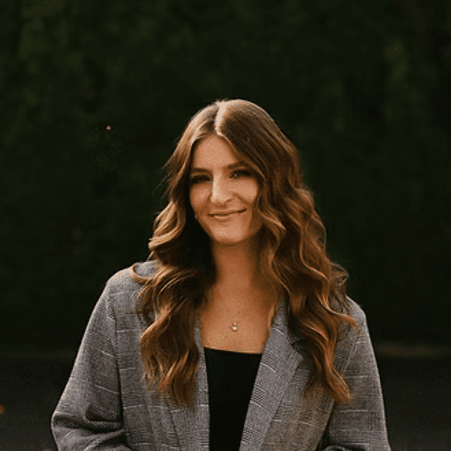 Portrait of April  Vanleeuwen, a professional stylist at Beautique Beauty Lounge, showcasing their expertise and style.