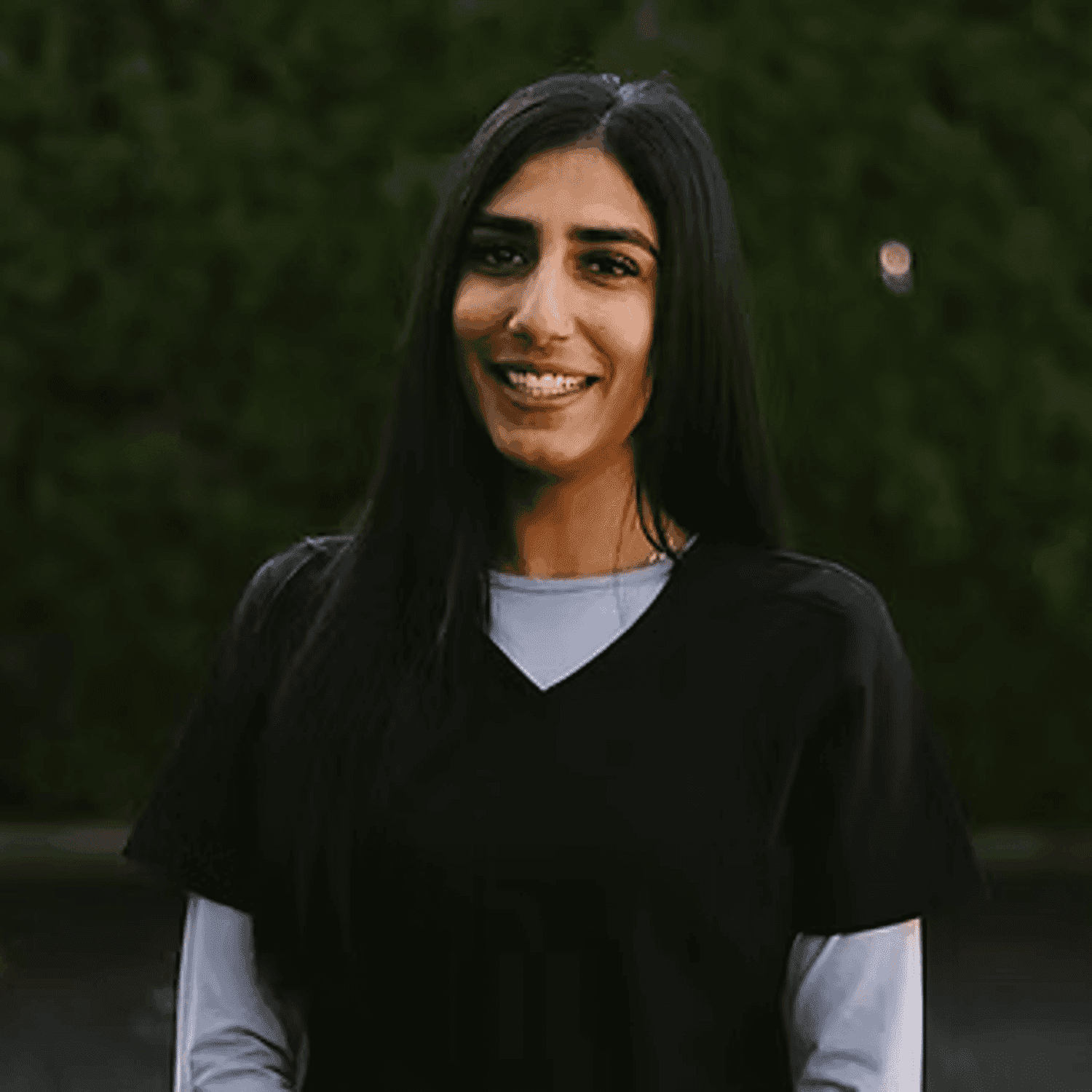 Portrait of Rav Aujla, a professional stylist at Beautique Beauty Lounge, showcasing their expertise and style.