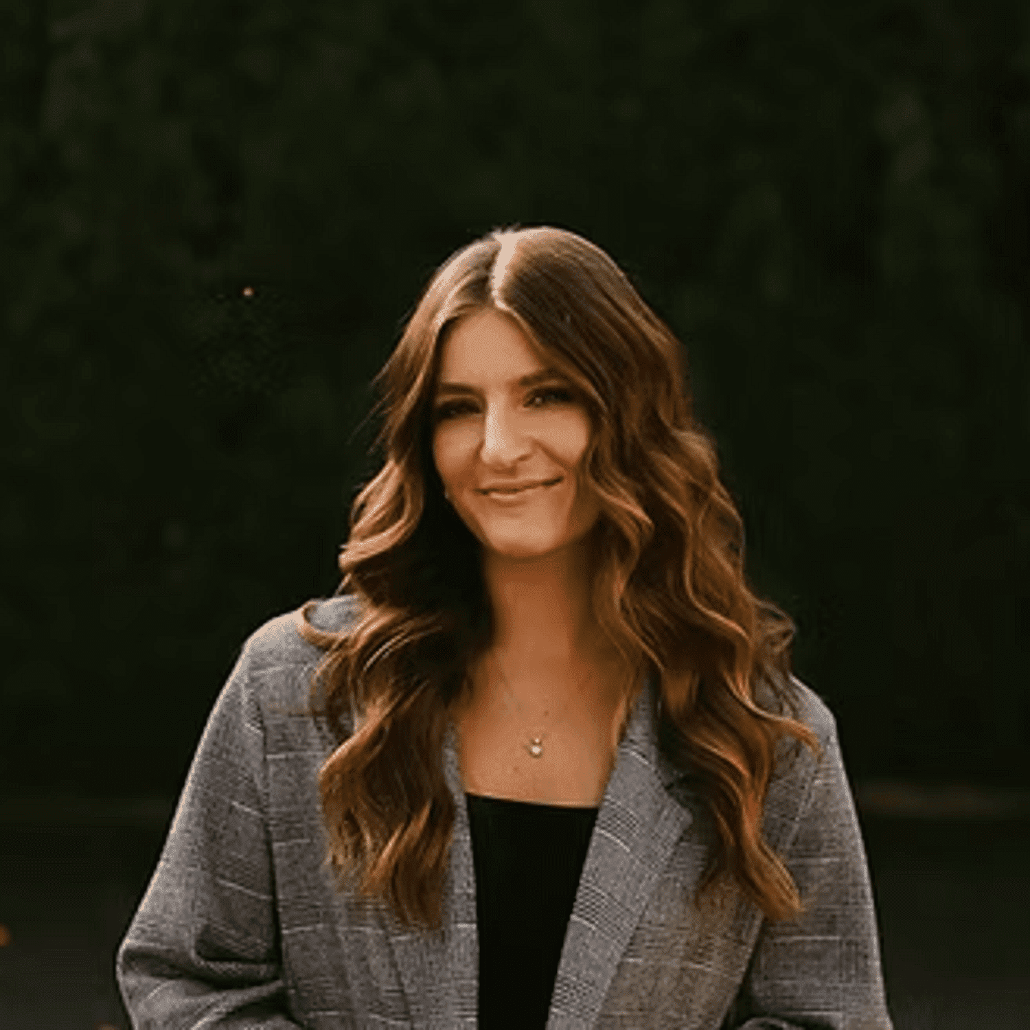 Portrait of April Vanleeuwen, a professional stylist at Beautique Beauty Lounge, showcasing their expertise and style.