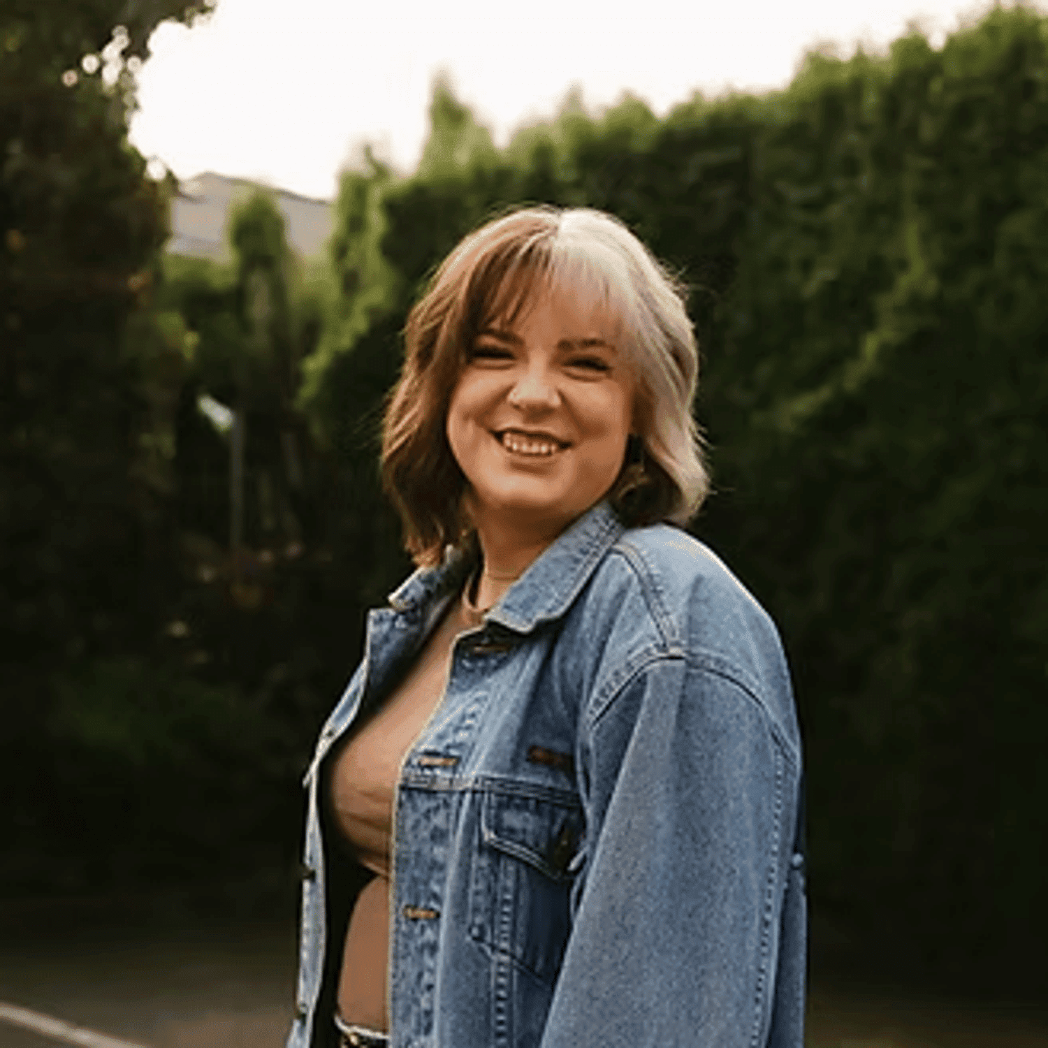 Portrait of Sarah Neufeld, a professional stylist at Beautique Beauty Lounge, showcasing their expertise and style.