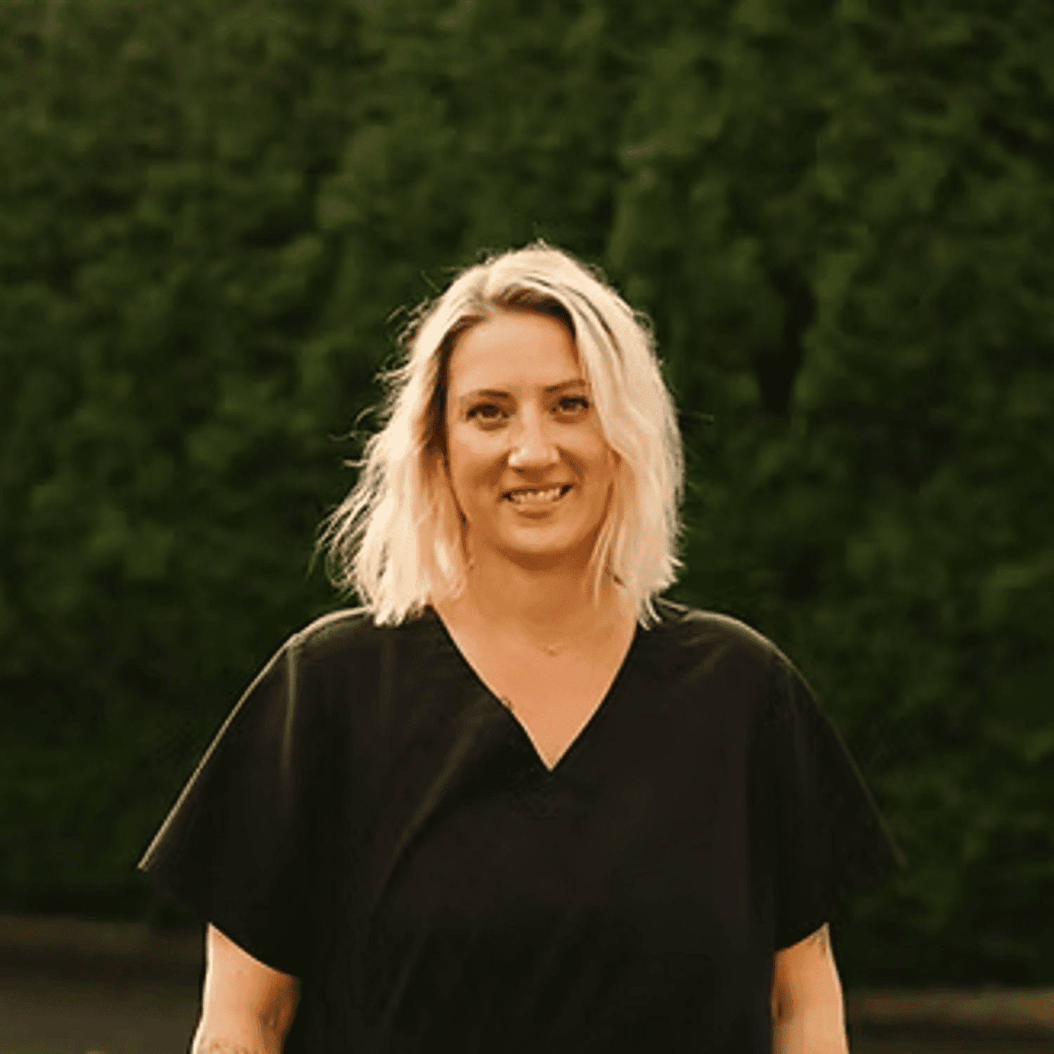 Portrait of Lindsay Williams, a professional stylist at Beautique Beauty Lounge, showcasing their expertise and style.
