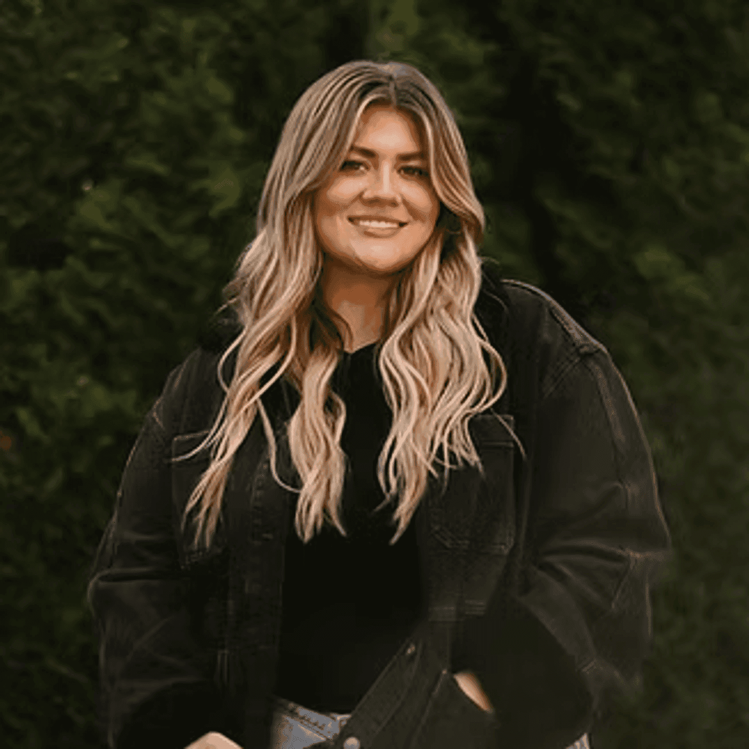 Portrait of Chelsea Budau, a professional stylist at Beautique Beauty Lounge, showcasing their expertise and style.