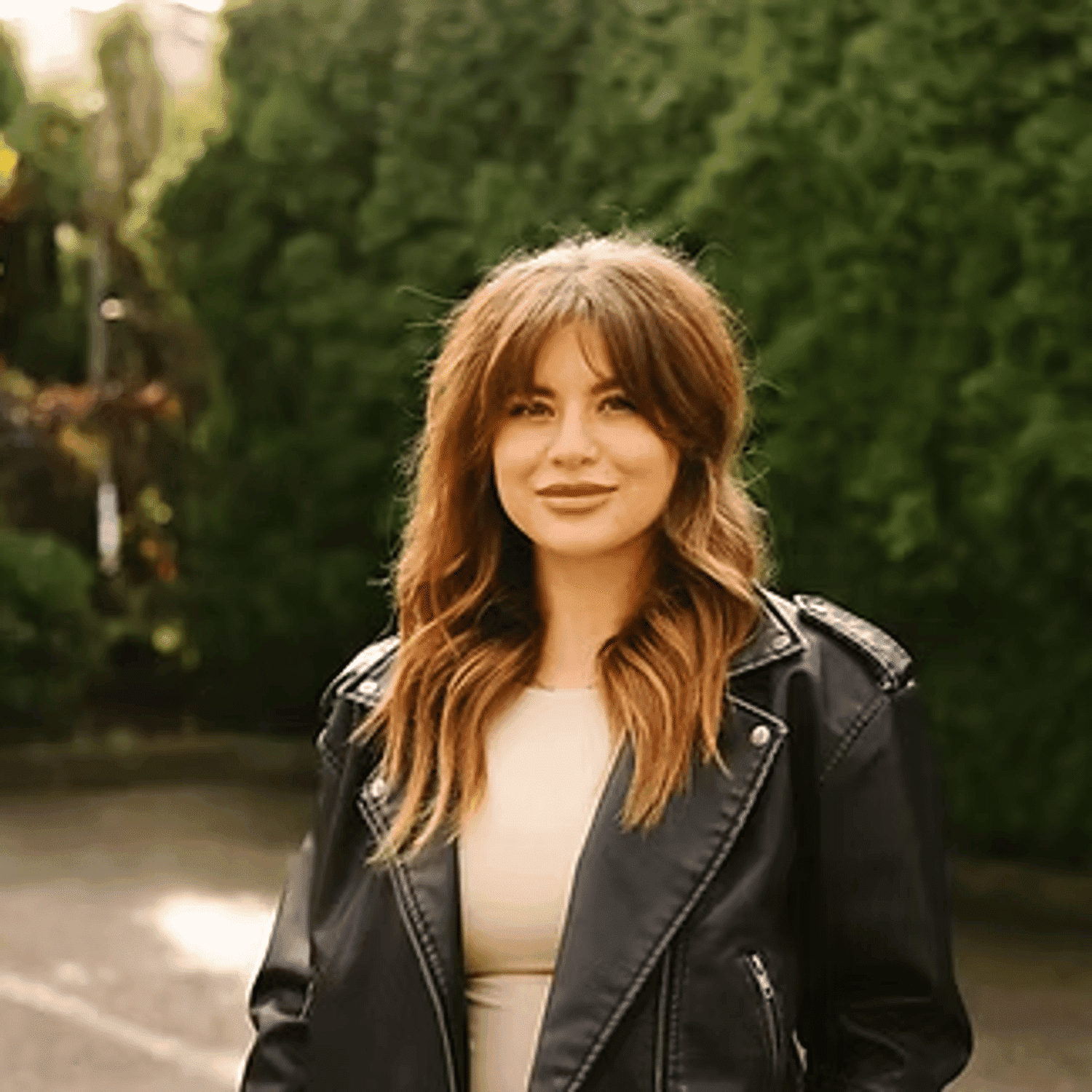 Portrait of Courtney Thomas, a professional stylist at Beautique Beauty Lounge, showcasing their expertise and style.