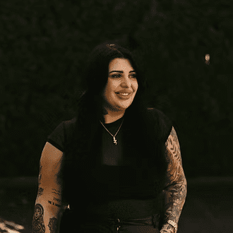 Portrait of Kelsey Lakota, a professional stylist at Beautique Beauty Lounge, showcasing their expertise and style.