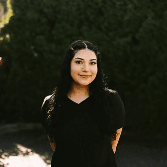 Portrait of Ermeena Sharif, a professional stylist at Beautique Beauty Lounge, showcasing their expertise and style.