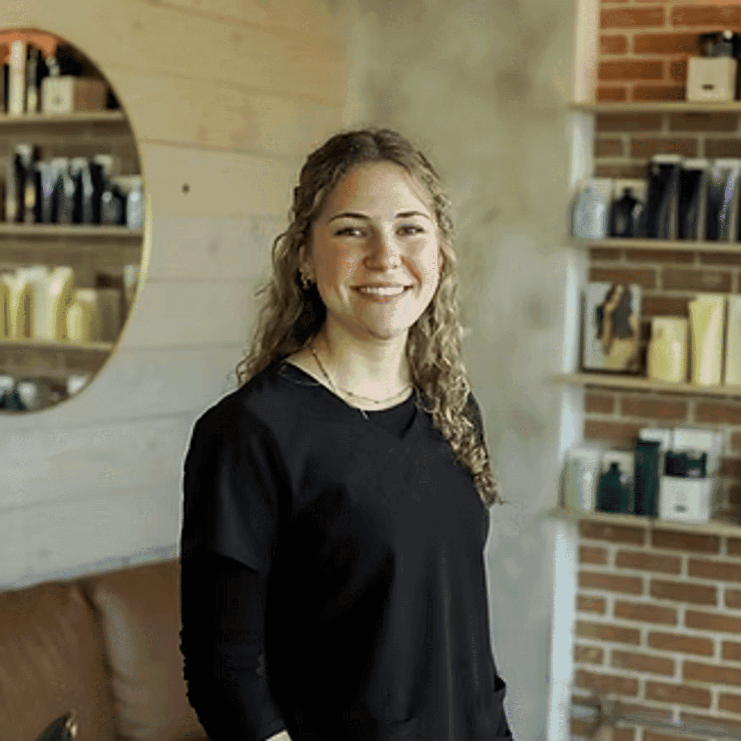 Portrait of Jenna Beukema, a professional stylist at Beautique Beauty Lounge, showcasing their expertise and style.