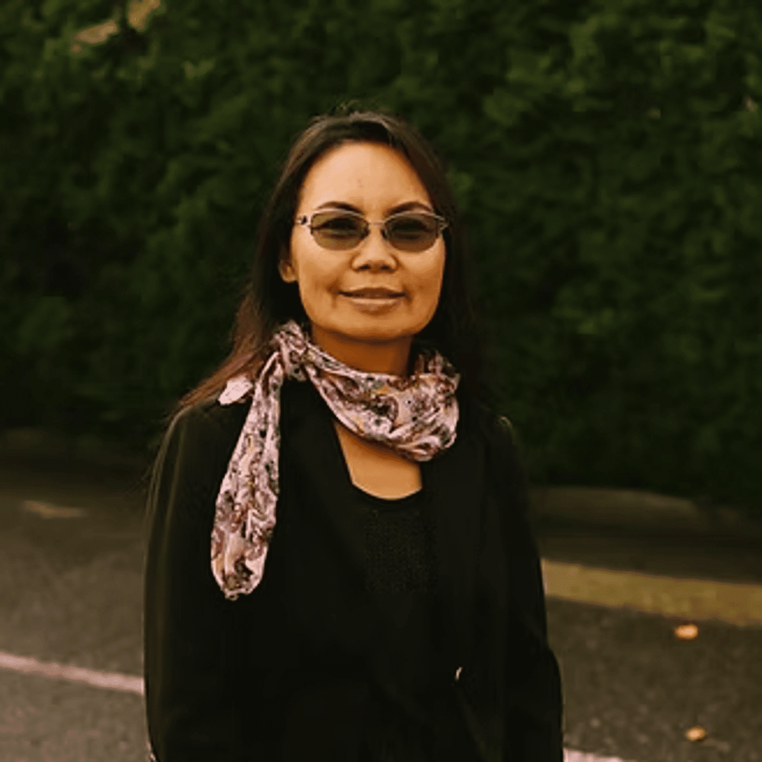 Portrait of Loon Phangnamkham, a professional stylist at Beautique Beauty Lounge, showcasing their expertise and style.